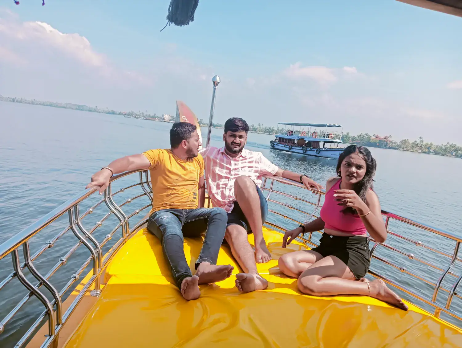 Guests relaxing at the front of a private Shikara in Alleppey
