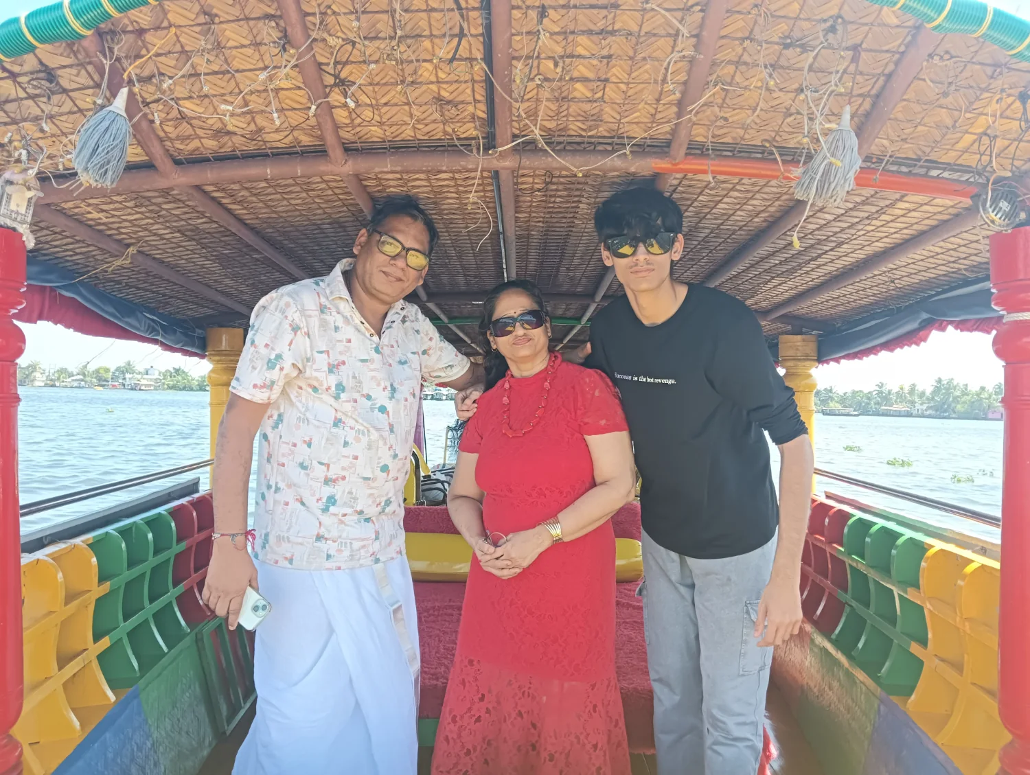 Guests standing inside the open-sided Shikara