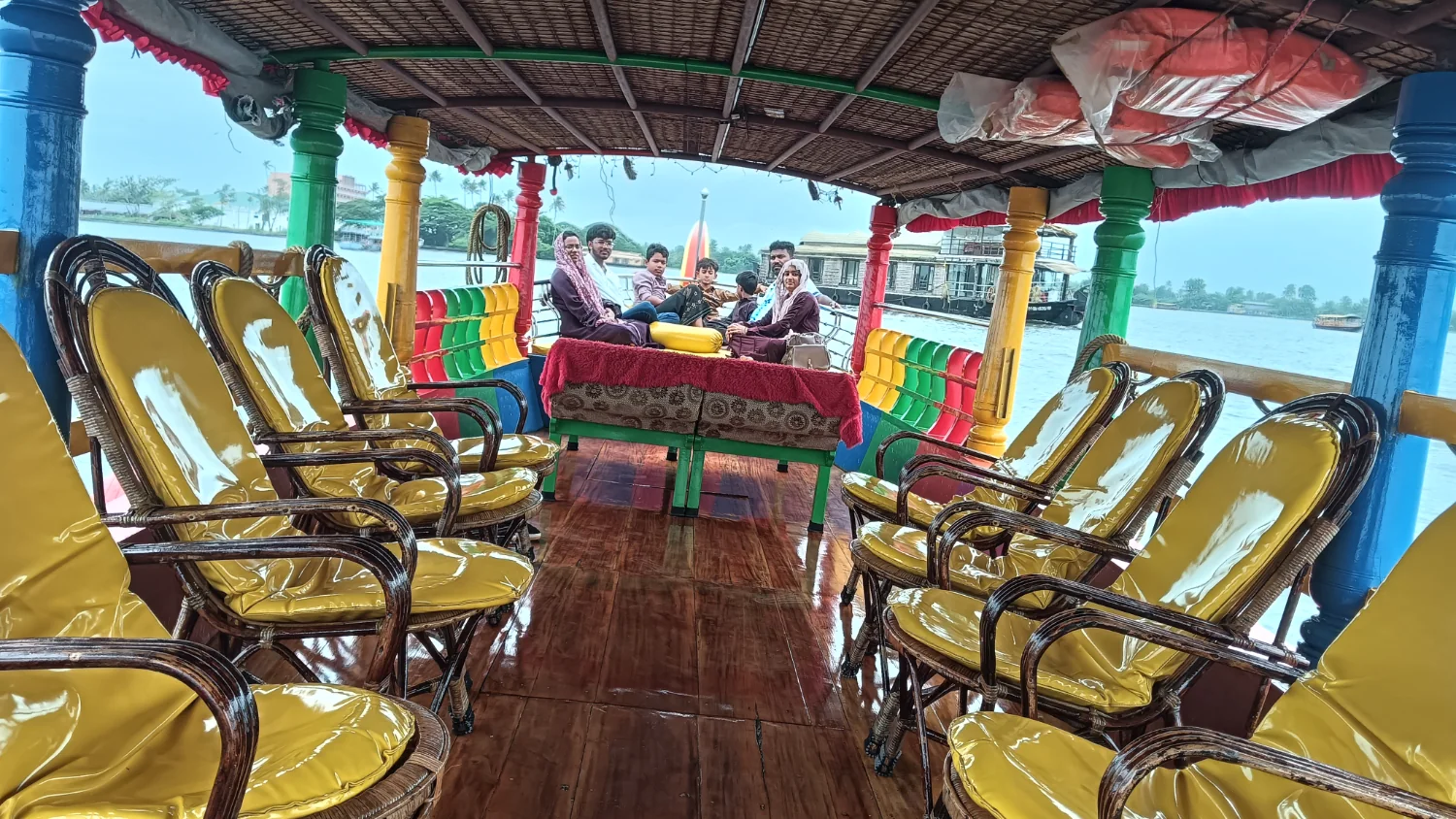 Client Shikara with open-sided seating arranged for guests